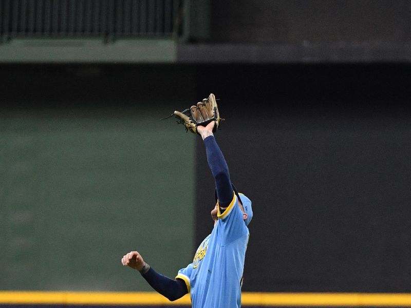 Sep 15, 2023; Milwaukee, Wisconsin, USA; Milwaukee Brewers second baseman Brice Turang (2) catches a fly ball against the Washington Nationals in the third fourth inning at American Family Field. Mandatory Credit: Michael McLoone-USA TODAY Sports