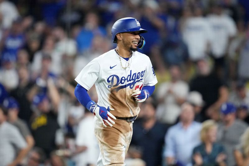 Aug 29, 2023; Los Angeles, California, USA; Los Angeles Dodgers second baseman Mookie Betts (50) celebrates after hitting a home run in the sixth inning Arizona Diamondbacksa at Dodger Stadium. Mandatory Credit: Kirby Lee-USA TODAY Sports