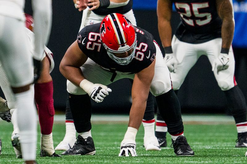 Atlanta Falcons guard Matthew Bergeron (65) lines up during the second half of an NFL football game against the Washington Commanders, Sunday, Oct. 15, 2023, in Atlanta. The Washington Commanders won 24-16. (AP Photo/Danny Karnik)