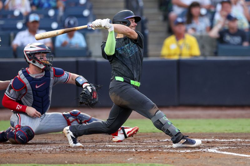 May 27, 2025; Tampa, Florida, USA; Tampa Bay Rays designated hitter Brandon Lowe (8) doubles against the Minnesota Twins in the fourth inning at George M. Steinbrenner Field. Mandatory Credit: Nathan Ray Seebeck-Imagn Images