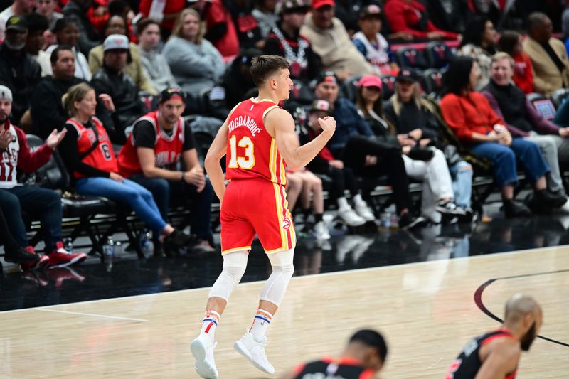 CHICAGO, IL - APRIL 1: Bogdan Bogdanovic #13 of the Atlanta Hawks celebrates during the game against the Chicago Bulls on April 1, 2024 at United Center in Chicago, Illinois. NOTE TO USER: User expressly acknowledges and agrees that, by downloading and or using this photograph, User is consenting to the terms and conditions of the Getty Images License Agreement. Mandatory Copyright Notice: Copyright 2024 NBAE (Photo by Adam Hagy/NBAE via Getty Images)