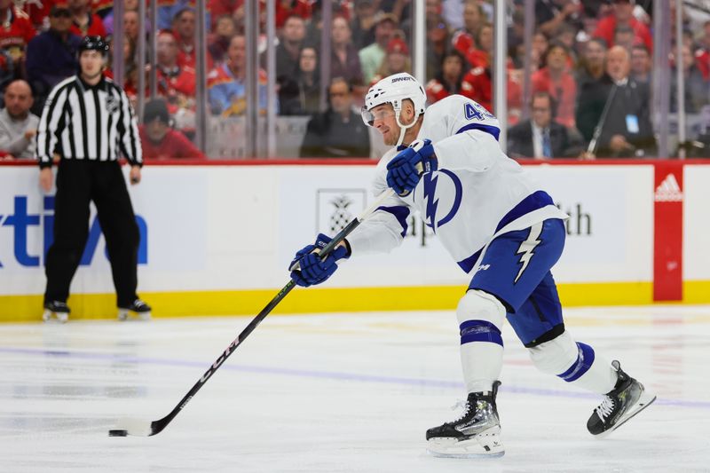 Apr 23, 2024; Sunrise, Florida, USA; Tampa Bay Lightning defenseman Darren Raddysh (43) shoots the puck against the Florida Panthers during the first period in game two of the first round of the 2024 Stanley Cup Playoffs at Amerant Bank Arena. Mandatory Credit: Sam Navarro-USA TODAY Sports