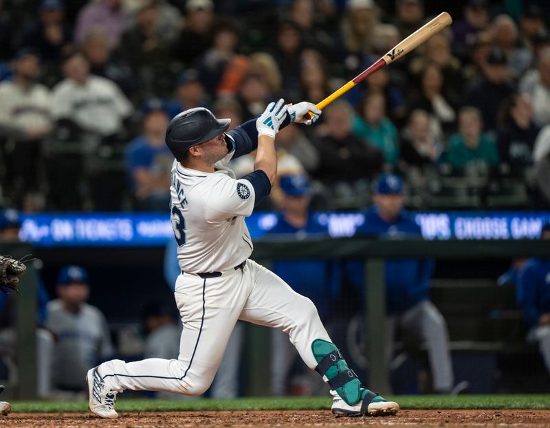 May 13, 2024; Seattle, Washington, USA; Seattle Mariners first baseman Ty France (23) hits a two-run home run during the eighth inning against the Kansas City Royals at T-Mobile Park. Mandatory Credit: Stephen Brashear-USA TODAY Sports