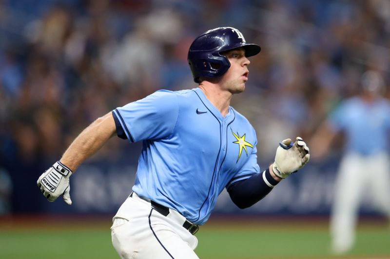 Apr 24, 2024; St. Petersburg, Florida, USA;  Tampa Bay Rays catcher Ben Rortvedt (30) hits an rbi double against the Detroit Tigers in the second inning at Tropicana Field. Mandatory Credit: Nathan Ray Seebeck-USA TODAY Sports