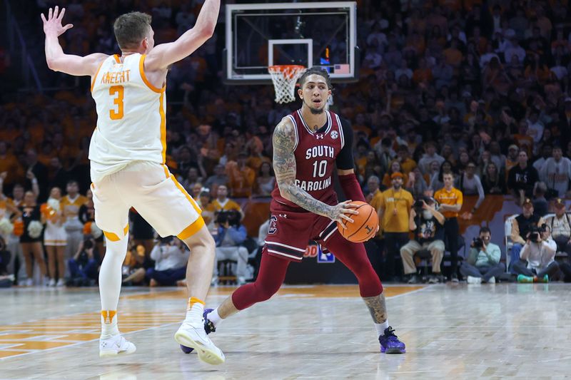 Jan 30, 2024; Knoxville, Tennessee, USA; South Carolina Gamecocks guard Myles Stute (10) looks to move the ball against Tennessee Volunteers guard Dalton Knecht (3) during the second half at Thompson-Boling Arena at Food City Center. Mandatory Credit: Randy Sartin-USA TODAY Sports