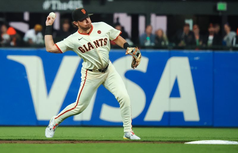 Sep 12, 2024; San Francisco, California, USA; San Francisco Giants shortstop Brett Wisely (0) throws the ball to first base against the Milwaukee Brewers during the third inning at Oracle Park. Mandatory Credit: Kelley L Cox-Imagn Images