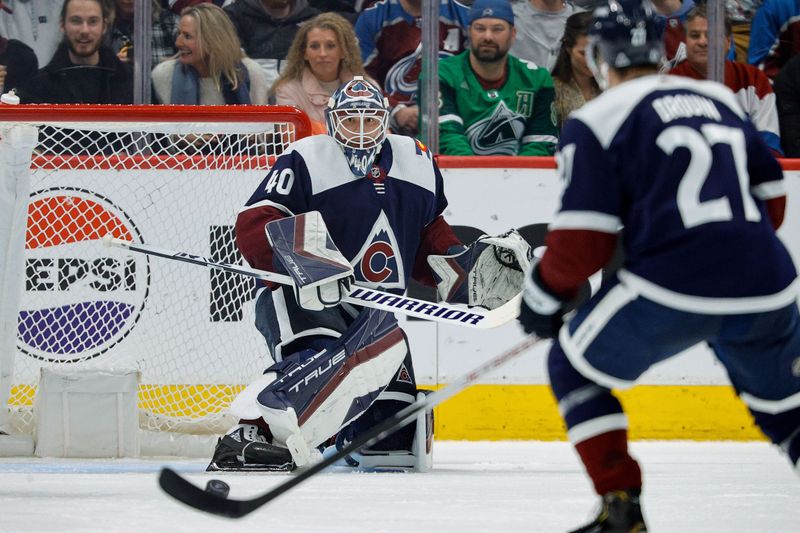 Mar 8, 2024; Denver, Colorado, USA; Colorado Avalanche goaltender Alexandar Georgiev (40) watches as the puck goes to left wing Jonathan Drouin (27) in the second period against the Minnesota Wild at Ball Arena. Mandatory Credit: Isaiah J. Downing-USA TODAY Sports