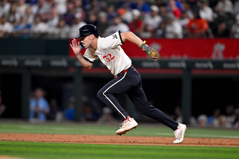 May 16, 2025; Arlington, Texas, USA; Texas Rangers center fielder Evan Carter (32) steals second base during the second inning against the Houston Astros at Globe Life Field. Mandatory Credit: Jerome Miron-Imagn Images