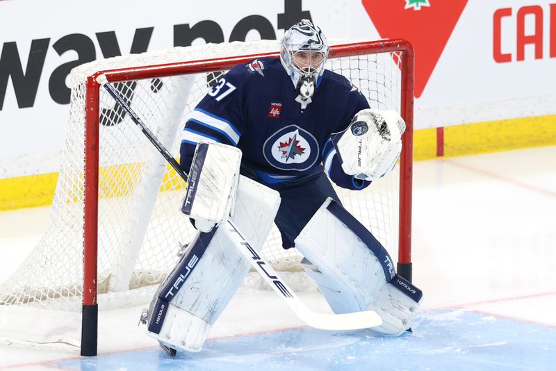 Apr 30, 2024; Winnipeg, Manitoba, CAN;Winnipeg Jets goaltender Connor Hellebuyck (37) warms up before the game against the Colorado Avalanche in game five of the first round of the 2024 Stanley Cup Playoffs at Canada Life Centre. Mandatory Credit: James Carey Lauder-USA TODAY Sports