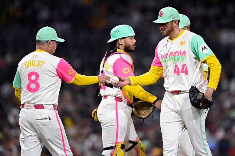 Apr 26, 2024; San Diego, California, USA; San Diego Padres manager Mike Shildt (8) takes the ball from starting pitcher Joe Musgrove (44) during the fourth inning against the Philadelphia Phillies at Petco Park. Mandatory Credit: Orlando Ramirez-USA TODAY Sports