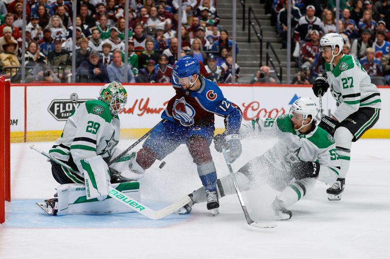 May 11, 2024; Denver, Colorado, USA; Colorado Avalanche right wing Brandon Duhaime (12) drives to the net against Dallas Stars goaltender Jake Oettinger (29) as defenseman Thomas Harley (55) defends in the second period in game three of the second round of the 2024 Stanley Cup Playoffs at Ball Arena. Mandatory Credit: Isaiah J. Downing-USA TODAY Sports