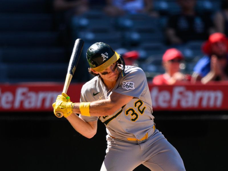 Sep 7, 2025; Anaheim, California, USA; Athletics right fielder Colby Thomas (32) hits a sacrifice fly to tie the game against the Los Angeles Angels during the eighth inning at Angel Stadium. Mandatory Credit: William Liang-Imagn Images