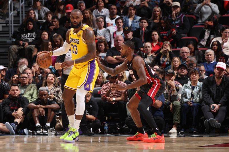 MIAMI, FL - DECEMBER 4:  LeBron James #23 of the Los Angeles Lakers handles the ball during the game against the Miami Heat on December 4, 2024 at Kaseya Center in Miami, Florida. NOTE TO USER: User expressly acknowledges and agrees that, by downloading and or using this Photograph, user is consenting to the terms and conditions of the Getty Images License Agreement. Mandatory Copyright Notice: Copyright 2024 NBAE (Photo by Joe Murphy/NBAE via Getty Images)