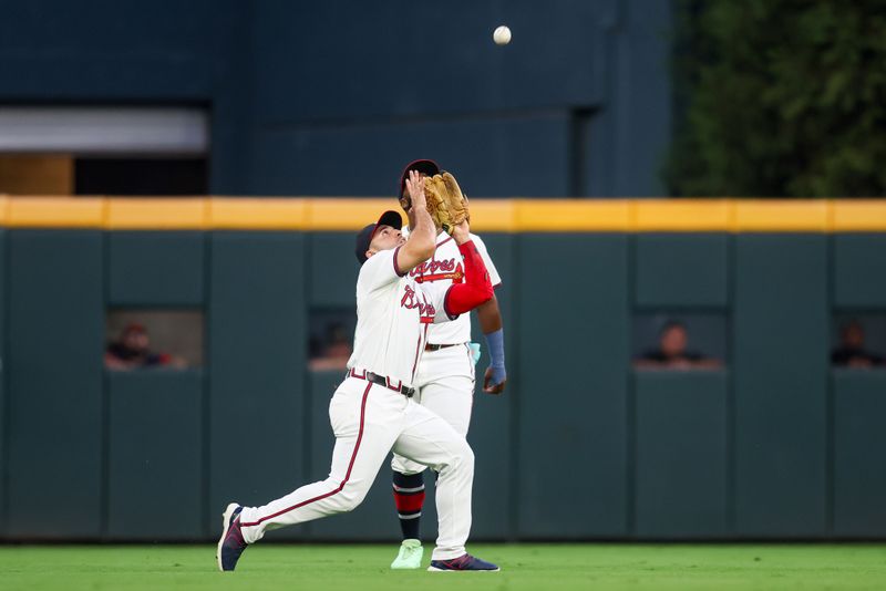 Sep 24, 2024; Atlanta, Georgia, USA; Atlanta Braves left fielder Ramon Laureano (18) catches a fly ball against the New York Mets in the first inning at Truist Park. Mandatory Credit: Brett Davis-Imagn Images
