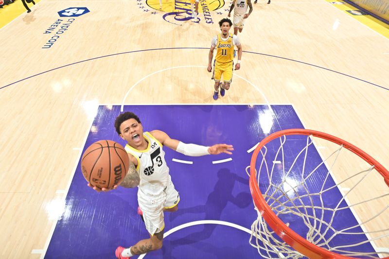 LOS ANGELES, CA - FEBRUARY 10:  Keyonte George #3 of the Utah Jazz drives to the basket during the game against the Los Angeles Lakers on February 10, 2025 at Crypto.Com Arena in Los Angeles, California. NOTE TO USER: User expressly acknowledges and agrees that, by downloading and/or using this Photograph, user is consenting to the terms and conditions of the Getty Images License Agreement. Mandatory Copyright Notice: Copyright 2025 NBAE (Photo by Adam Pantozzi/NBAE via Getty Images)