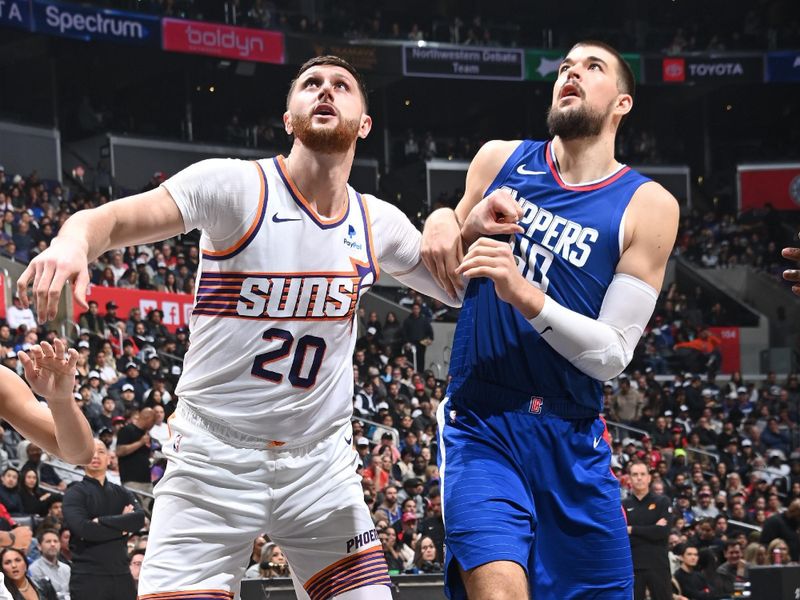 LOS ANGELES, CA - JANUARY 8: Jusuf Nurkic #20 of the Phoenix Suns and Ivica Zubac #40 of the LA Clippers wait for a rebound during the game on January 8, 2024 at Crypto.Com Arena in Los Angeles, California. NOTE TO USER: User expressly acknowledges and agrees that, by downloading and/or using this Photograph, user is consenting to the terms and conditions of the Getty Images License Agreement. Mandatory Copyright Notice: Copyright 2024 NBAE (Photo by Andrew D. Bernstein/NBAE via Getty Images)