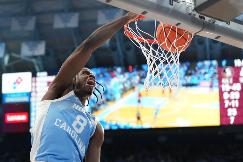Dec 30, 2025; Chapel Hill, North Carolina, USA; North Carolina Tar Heels forward Caleb Wilson (8) scores in the second half at Dean E. Smith Center. Mandatory Credit: Bob Donnan-Imagn Images