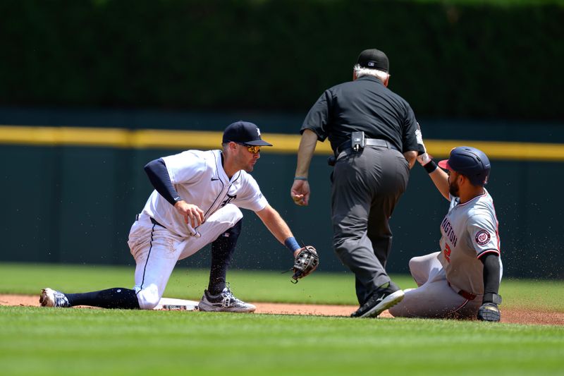 Jun 13, 2024; Detroit, Michigan, USA;  Detroit Tigers shortstop Ryan Kreidler (32) gets ready to tag out Washington Nationals second baseman Luis García Jr. (2) trying to steal second base in the fifth inning at Comerica Park. Mandatory Credit: Lon Horwedel-USA TODAY Sports