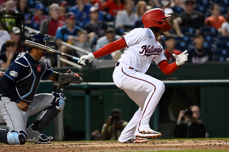 Apr 4, 2023; Washington, District of Columbia, USA; Washington Nationals shortstop CJ Abrams (5) hits a double against the Tampa Bay Rays during the second inning at Nationals Park. Mandatory Credit: Brad Mills-USA TODAY Sports