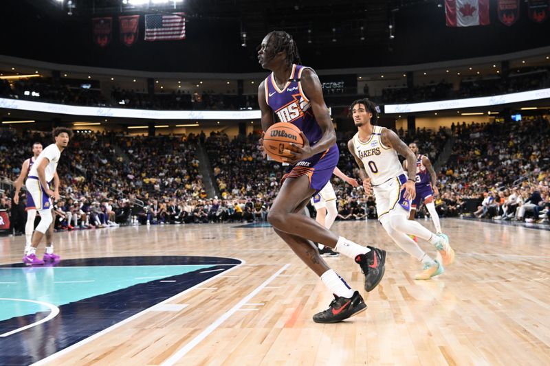 LOS ANGELES, CA - OCTOBER 6: Bol Bol #11 of the Phoenix Suns dribbles the ball during the game against the Los Angeles Lakers on October 6, 2024 at Acrisure Arena in Palm Springs, California. NOTE TO USER: User expressly acknowledges and agrees that, by downloading and/or using this Photograph, user is consenting to the terms and conditions of the Getty Images License Agreement. Mandatory Copyright Notice: Copyright 2024 NBAE (Photo by Adam Pantozzi/NBAE via Getty Images)