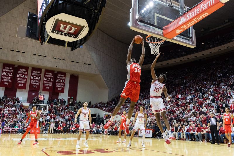 Jan 28, 2023; Bloomington, Indiana, USA; Ohio State Buckeyes center Felix Okpara (34) shoots the ball while Indiana Hoosiers forward Kaleb Banks (10) defends in the second half  at Simon Skjodt Assembly Hall. Mandatory Credit: Trevor Ruszkowski-USA TODAY Sports