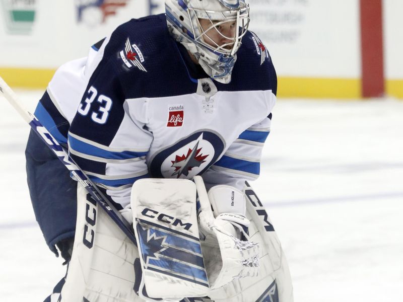 Jan 13, 2023; Pittsburgh, Pennsylvania, USA; Winnipeg Jets goaltender David Rittich (33) warms up before the game against the Pittsburgh Penguins at PPG Paints Arena. Mandatory Credit: Charles LeClaire-USA TODAY Sports