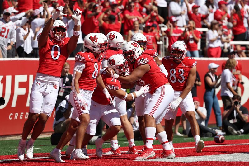 Sep 23, 2023; Salt Lake City, Utah, USA; The Utah Utes defense celebrates a touchdown after an interception against the UCLA Bruins in the first quarter at Rice-Eccles Stadium. Mandatory Credit: Rob Gray-USA TODAY Sports