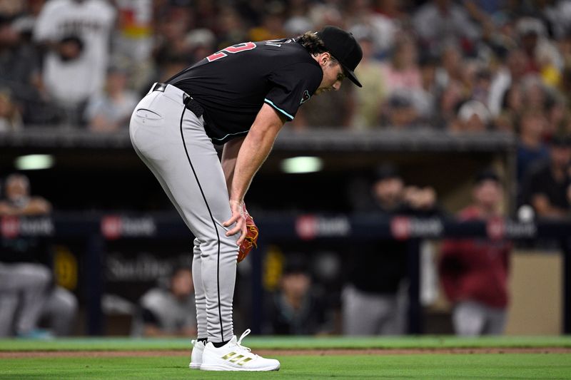 Jul 6, 2024; San Diego, California, USA; Arizona Diamondbacks starting pitcher Brandon Pfaadt (32) reacts after being hit by a batted ball during the fifth inning against the San Diego Padres at Petco Park. Mandatory Credit: Orlando Ramirez-USA TODAY Sports