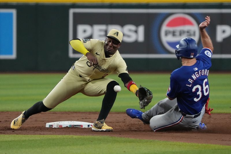 Sep 10, 2024; Phoenix, Arizona, USA; Texas Rangers outfielder Wyatt Langford (36) steals the base in front of Arizona Diamondbacks shortstop Geraldo Perdomo (2) in the sixth inning at Chase Field. Mandatory Credit: Rick Scuteri-Imagn Images