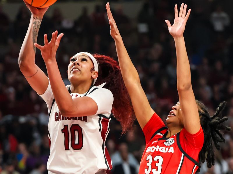 Feb 18, 2024; Columbia, South Carolina, USA; South Carolina Gamecocks center Kamilla Cardoso (10) shoots over Georgia Lady Bulldogs forward Destiny Thomas (33) in the first half at Colonial Life Arena. Mandatory Credit: Jeff Blake-USA TODAY Sports