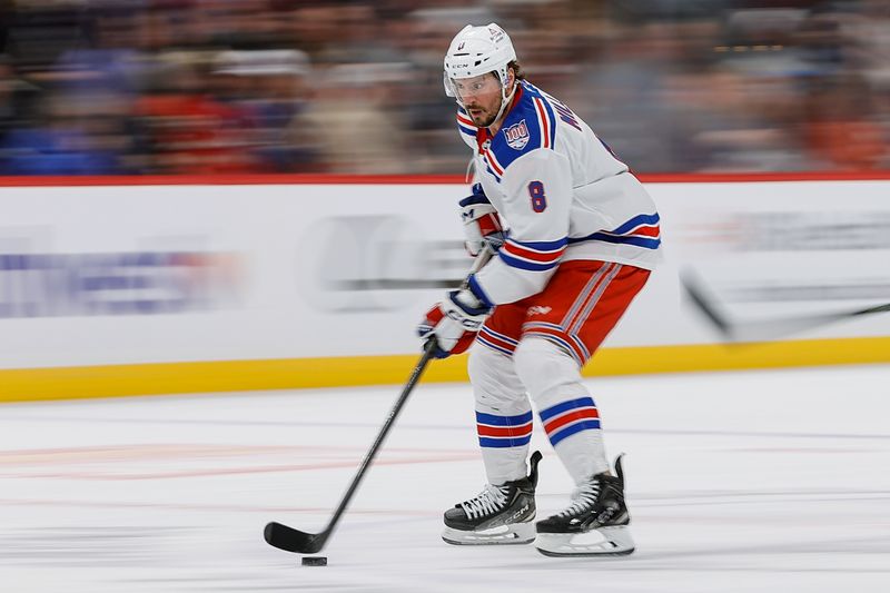Nov 20, 2025; Denver, Colorado, USA; New York Rangers center J.T. Miller (8) controls the puck in the first period against the Colorado Avalanche at Ball Arena. Mandatory Credit: Isaiah J. Downing-Imagn Images