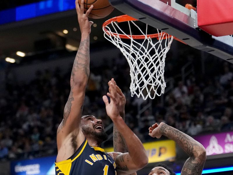 INDIANAPOLIS, INDIANA - NOVEMBER 06: Obi Toppin #1 of the Indiana Pacers attempts a layup while being guarded by Julian Champagnie #30 of the San Antonio Spurs in the third quarter at Gainbridge Fieldhouse on November 06, 2023 in Indianapolis, Indiana. NOTE TO USER: User expressly acknowledges and agrees that, by downloading and or using this photograph, User is consenting to the terms and conditions of the Getty Images License Agreement. (Photo by Dylan Buell/Getty Images)