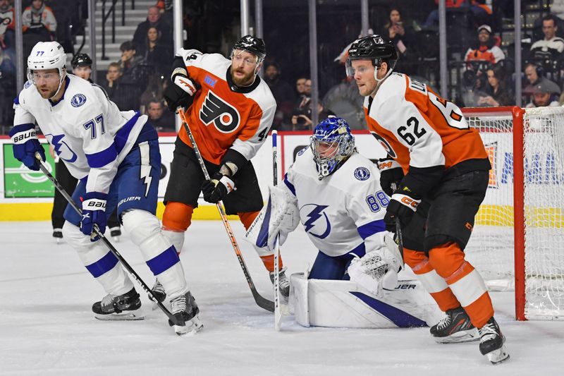 Feb 27, 2024; Philadelphia, Pennsylvania, USA; Tampa Bay Lightning defenseman Victor Hedman (77) and goaltender Andrei Vasilevskiy (88) battle with Philadelphia Flyers left wing Nicolas Deslauriers (44) and right wing Olle Lycksell (62) during the first period at Wells Fargo Center. Mandatory Credit: Eric Hartline-USA TODAY Sports