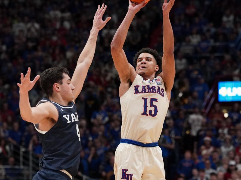 Dec 22, 2023; Lawrence, Kansas, USA; Kansas Jayhawks guard Kevin McCullar Jr. (15) shoots over Yale Bulldogs guard John Poulakidas (4) during the second half at Allen Fieldhouse. Mandatory Credit: Denny Medley-USA TODAY Sports