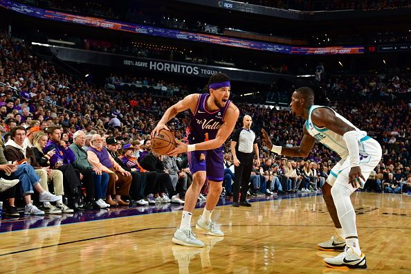 PHOENIX, AZ - DECEMBER 29: Devin Booker #1 of the Phoenix Suns handles the ball during the game against the Charlotte Hornets on December 29, 2023 at Footprint Center in Phoenix, Arizona. NOTE TO USER: User expressly acknowledges and agrees that, by downloading and or using this photograph, user is consenting to the terms and conditions of the Getty Images License Agreement. Mandatory Copyright Notice: Copyright 2023 NBAE (Photo by Kate Frese/NBAE via Getty Images)
