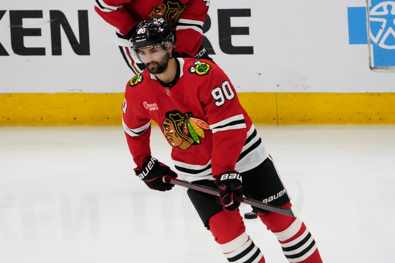 Mar 23, 2025; Chicago, Illinois, USA; Chicago Blackhawks center Joe Veleno (90) warms up before a game against the Philadelphia Flyers at United Center. Mandatory Credit: David Banks-Imagn Images