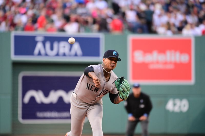 Jun 16, 2024; Boston, Massachusetts, USA; New York Yankees starting pitcher Marcus Stroman (0) pitches against the Boston Red Sox during the first inning at Fenway Park. Mandatory Credit: Eric Canha-USA TODAY Sports