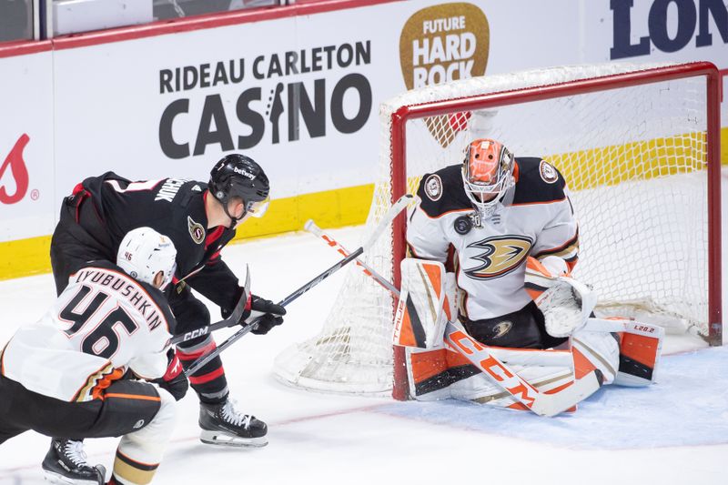 Feb 15, 2024; Ottawa, Ontario, CAN; Anaheim Ducks goalie Lukas Dostal (1) makes a save on a shot from Ottawa Senators left wing Brady Tkachuk (7) in the third period at the Canadian Tire Centre. Mandatory Credit: Marc DesRosiers-USA TODAY Sports