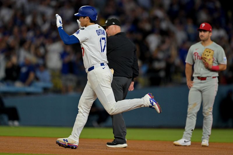 Sep 17, 2025; Los Angeles, California, USA;  Los Angeles Dodgers designated hitter Shohei Ohtani (17) rounds the bases after hitting his 51st home run of the season in the eighth inning against the Philadelphia Phillies at Dodger Stadium. Mandatory Credit: Jayne Kamin-Oncea-Imagn Images