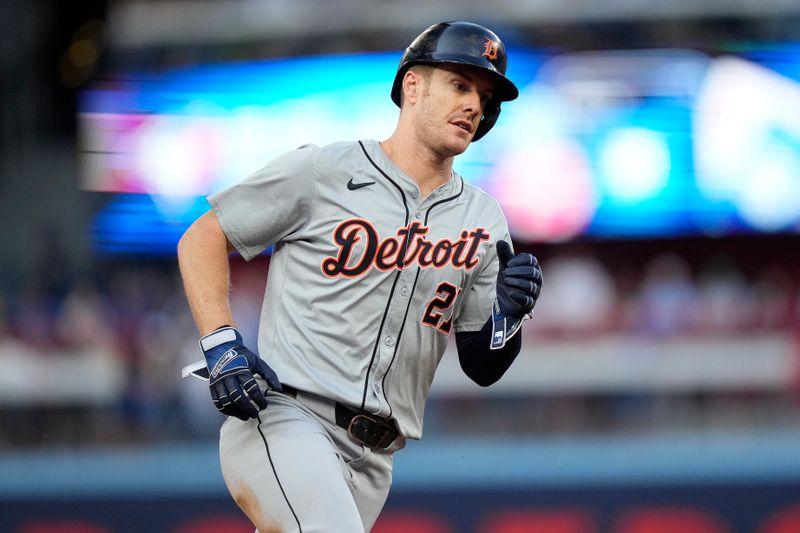 Jul 19, 2024; Toronto, Ontario, CAN; Detroit Tigers designated hitter Mark Canha (21) runs to third base during the second inning against the Toronto Blue Jays at Rogers Centre. Mandatory Credit: John E. Sokolowski-USA TODAY Sports