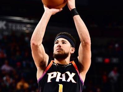 PHOENIX, AZ - DECEMBER 2: Devin Booker #1 of the Phoenix Suns shoots a free throw during the game against the Memphis Grizzlies on December 2, 2023 at Footprint Center in Phoenix, Arizona. NOTE TO USER: User expressly acknowledges and agrees that, by downloading and or using this photograph, user is consenting to the terms and conditions of the Getty Images License Agreement. Mandatory Copyright Notice: Copyright 2023 NBAE (Photo by Barry Gossage/NBAE via Getty Images)