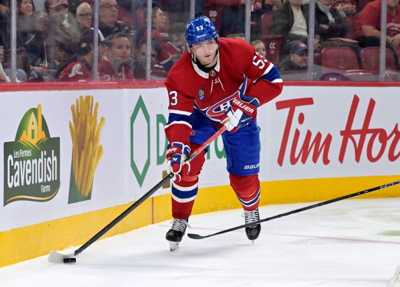 Nov 1, 2025; Montreal, Quebec, CAN; Montreal Canadiens defenseman Noah Dobson (53) plays the puck during the second period of the game against the Ottawa Senators at the Bell Centre. Mandatory Credit: Eric Bolte-Imagn Images