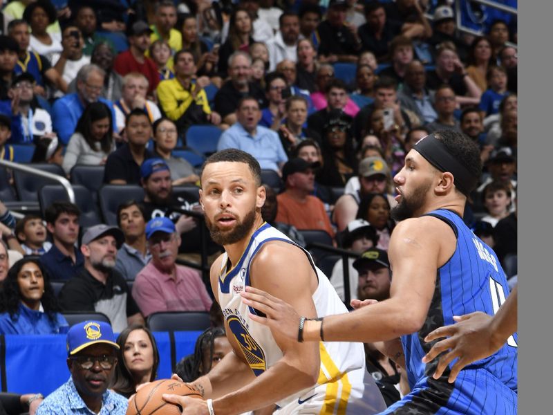 ORLANDO, FL - MARCH 27: Stephen Curry #30 of the Golden State Warriors handles the ball during the game against the Orlando Magic on March 27, 2024 at Amway Center in Orlando, Florida. NOTE TO USER: User expressly acknowledges and agrees that, by downloading and or using this photograph, User is consenting to the terms and conditions of the Getty Images License Agreement. Mandatory Copyright Notice: Copyright 2024 NBAE (Photo by Fernando Medina/NBAE via Getty Images)