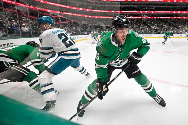 Nov 20, 2024; Dallas, Texas, USA; Dallas Stars defenseman Ilya Lyubushkin (46) takes the puck away from San Jose Sharks center Alexander Wennberg (21) during the third period at the American Airlines Center. Mandatory Credit: Jerome Miron-Imagn Images