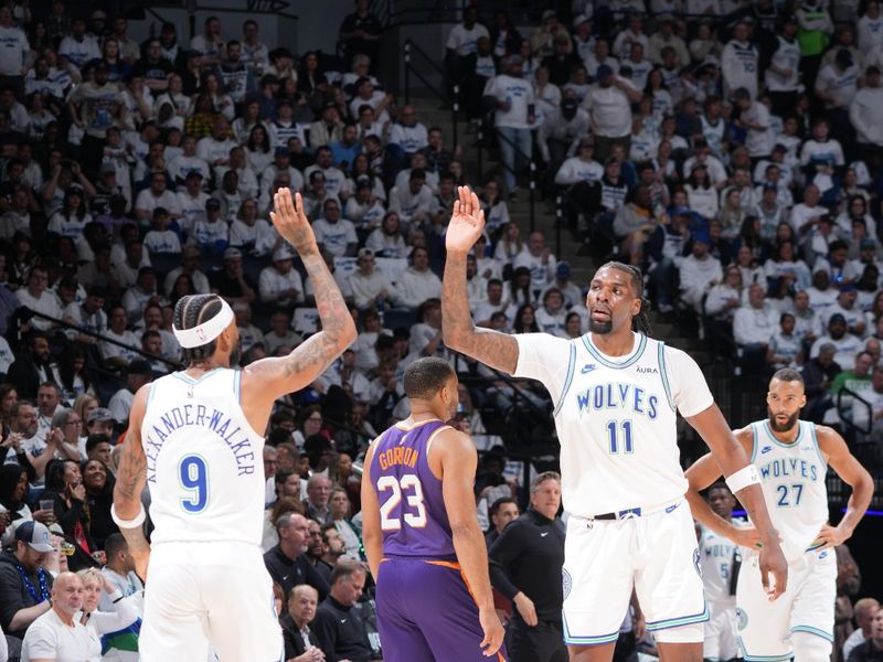 MINNEAPOLIS, MN -  APRIL 20: Nickeil Alexander-Walker #9 of the Minnesota Timberwolves and Naz Reid #11 of the Minnesota Timberwolves high five during Round One Game One of the 2024 NBA Playoffs against the Phoenix Suns on April 20, 2024 at Target Center in Minneapolis, Minnesota. NOTE TO USER: User expressly acknowledges and agrees that, by downloading and or using this Photograph, user is consenting to the terms and conditions of the Getty Images License Agreement. Mandatory Copyright Notice: Copyright 2024 NBAE (Photo by Jordan Johnson/NBAE via Getty Images)