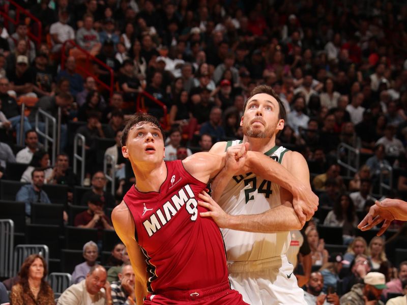 MIAMI, FL - NOVEMBER 26: Pelle Larsson #9 of the Miami Heat and Pat Connaughton #24 of the Milwaukee Bucks wait for a rebound during the Emirates NBA Cup game on November 26, 2024 at Kaseya Center in Miami, Florida. NOTE TO USER: User expressly acknowledges and agrees that, by downloading and or using this Photograph, user is consenting to the terms and conditions of the Getty Images License Agreement. Mandatory Copyright Notice: Copyright 2024 NBAE (Photo by Issac Baldizon/NBAE via Getty Images)