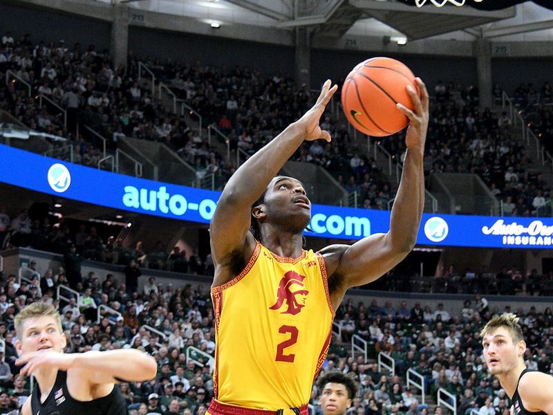 Jan 5, 2026; East Lansing, Michigan, USA;  Southern California Trojans forward Ezra Ausar (2) shoots off the glass against the Michigan State Spartans during the first half at Jack Breslin Student Events Center. Mandatory Credit: Dale Young-Imagn Images