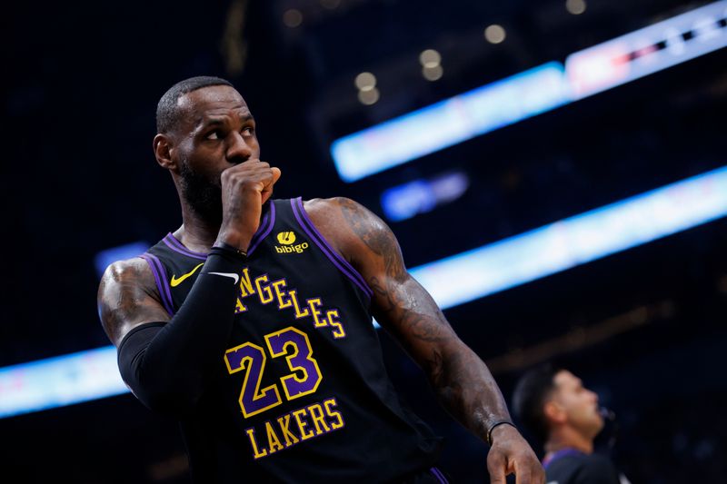 TORONTO, CANADA - APRIL 2: LeBron James #23 of the Los Angeles Lakers walks the court during a break in play against the Toronto Raptors in the first half at Scotiabank Arena on April 2, 2024 in Toronto, Canada. NOTE TO USER: User expressly acknowledges and agrees that, by downloading and or using this photograph, User is consenting to the terms and conditions of the Getty Images License Agreement. (Photo by Cole Burston/Getty Images)