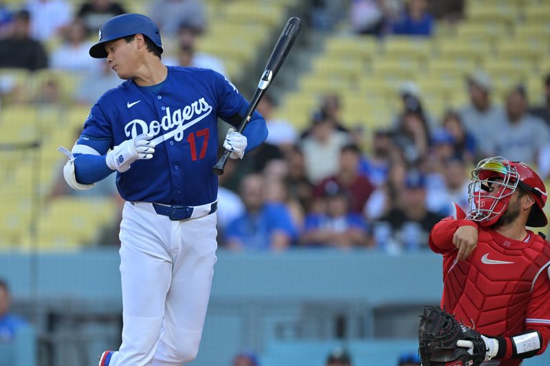 Mar 24, 2026; Los Angeles, California, USA;  Los Angeles Dodgers two-way player Shohei Ohtani (17) gets out of the way as Los Angeles Angels catcher Travis D'Arnaud (25) returns the ball to the pitcher in the first inning at Dodger Stadium. Mandatory Credit: Jayne Kamin-Oncea-Imagn Images