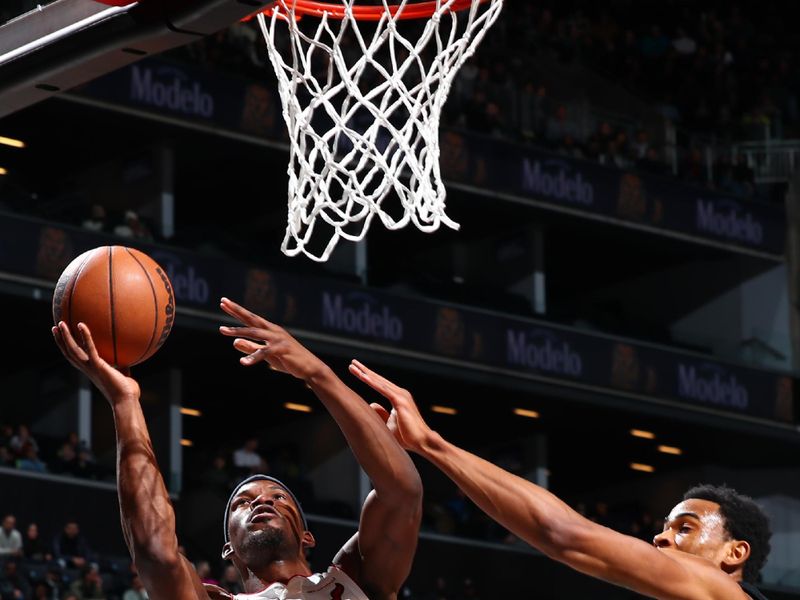 BROOKLYN, NY - JANUARY 15: Jimmy Butler #22 of the Miami Heat shoots the ball during the game against the Brooklyn Nets on January 15, 2024 at Barclays Center in Brooklyn, New York. NOTE TO USER: User expressly acknowledges and agrees that, by downloading and or using this Photograph, user is consenting to the terms and conditions of the Getty Images License Agreement. Mandatory Copyright Notice: Copyright 2024 NBAE (Photo by David Nemec/NBAE via Getty Images)